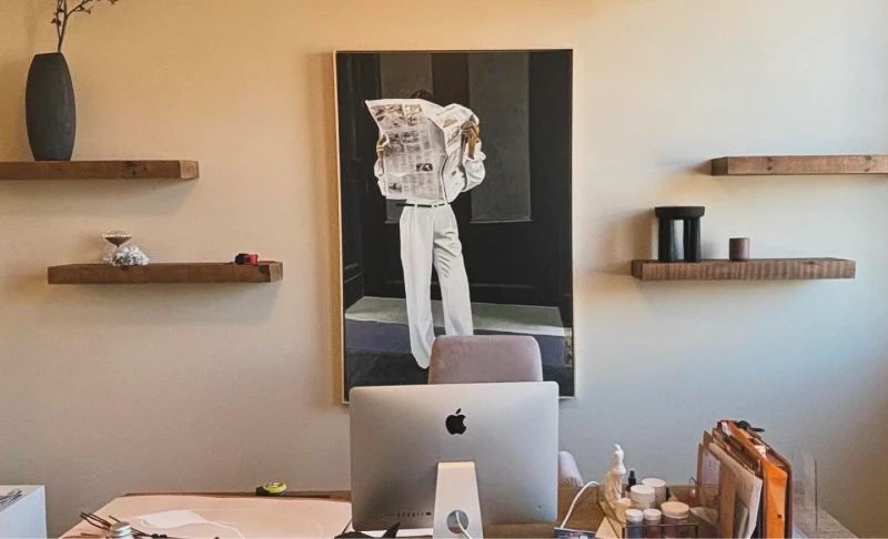 Paint in a home office above a desk with floating shelves