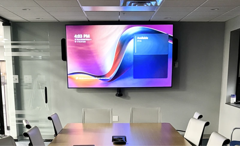 TV mounted on wall in conference room