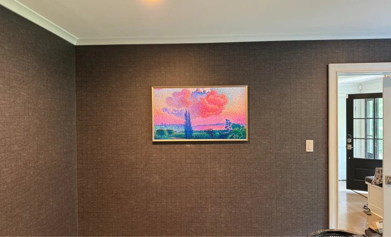 Samsung Frame TV wall-mounted to resemble artwork in a living room