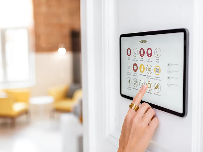 Controlling home with a digital touch screen panel installed on the wall in the living room