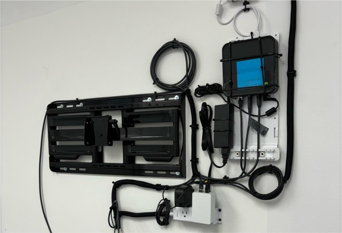 Cable system mounted on a wall for TV installation