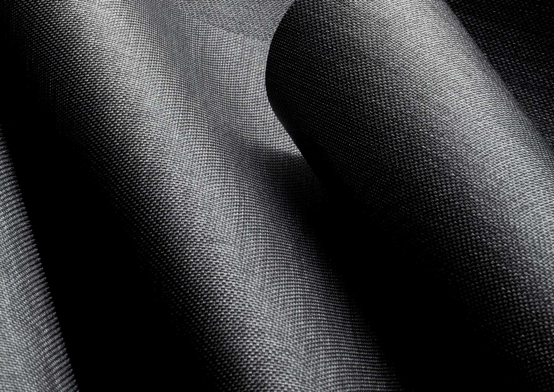 Dark textiles for fabricating roller shades