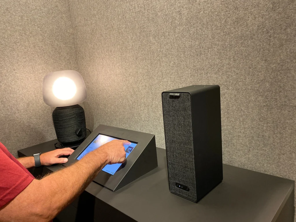 A man trying out the Sonos speaker display